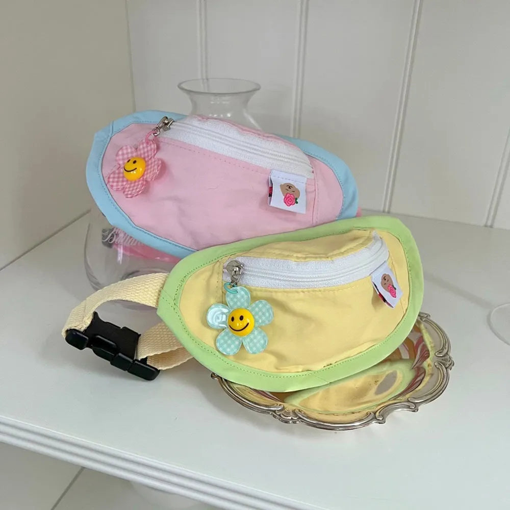 Powder blue messenger bag-style dog backpack for holding poop bags, shown with adjustable chest strap.