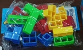 Balance stacking game with 16 plastic building blocks, chassis, and base on a table