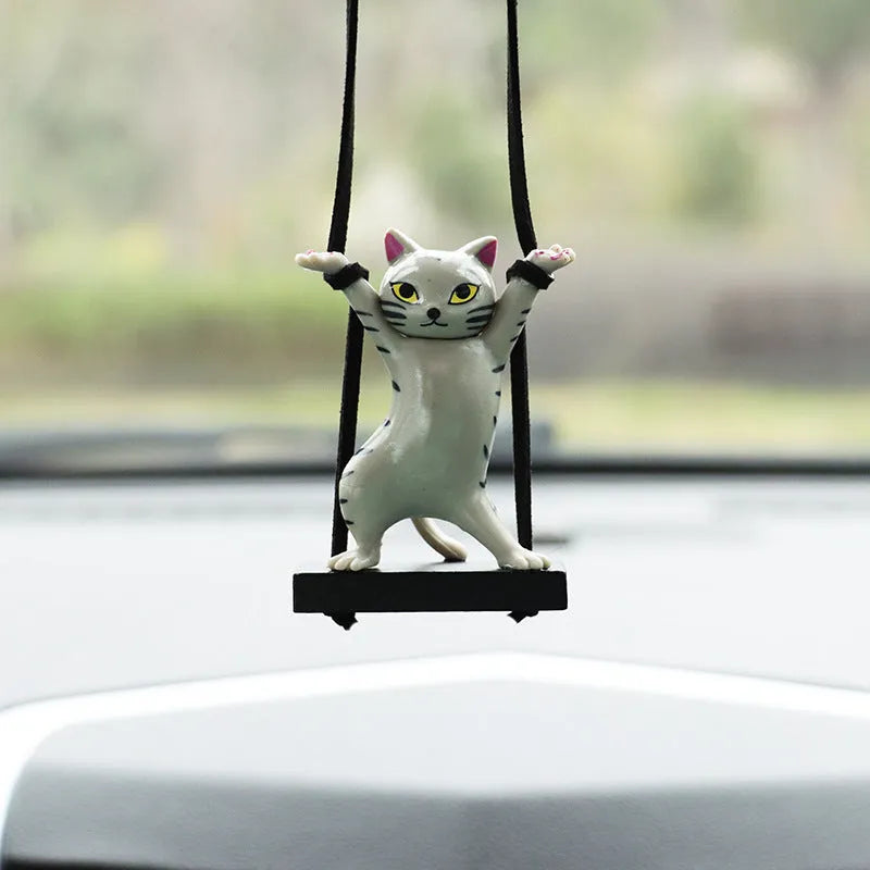 Cartoon-style resin cat pendant on a rope for car interior decoration