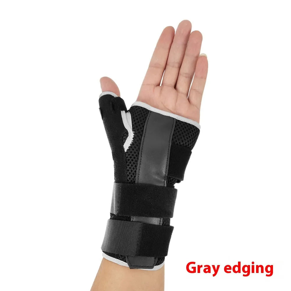 Black carbon fibre sports wrist guard with grey edging and an adjustable thumb strap.