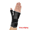 Black carbon fibre sports wrist guard with grey edging and an adjustable thumb strap.