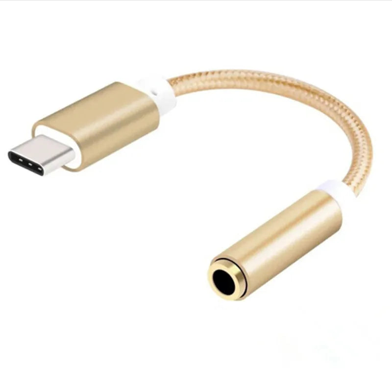 Close-up of a short black nylon Type-C to 3.5mm female headphone adapter cable.