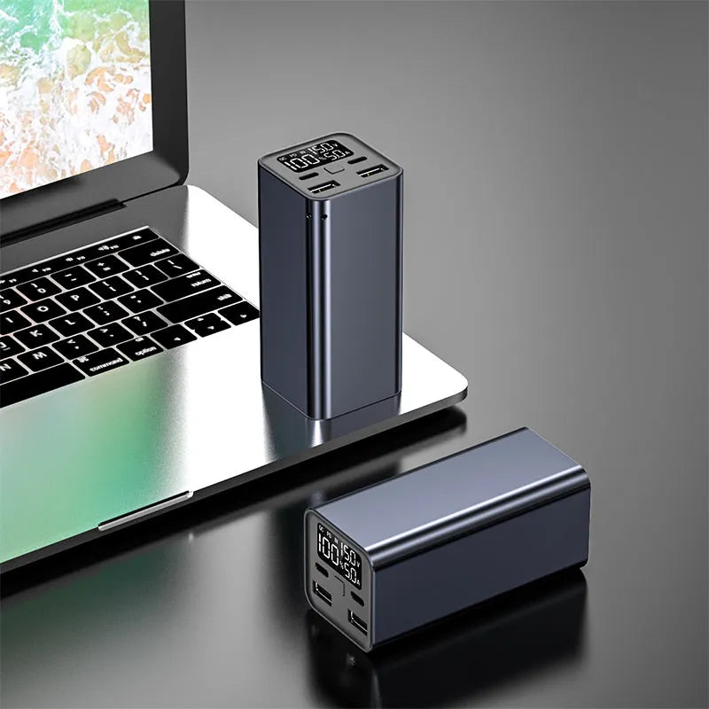 65W metal power bank in black, blue, or grey, showing size scale and USB-C port.