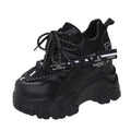 Women's white and black mesh platform sports shoes with cross-strap design and rubber sole