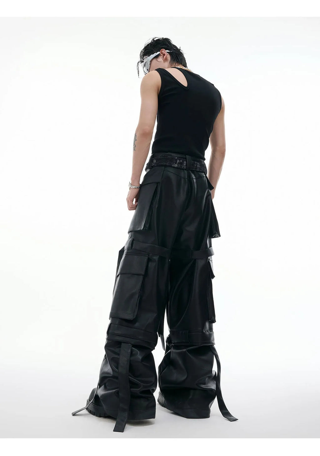 Black loose-fit retro pants with quilted stitching and multiple pockets on a model