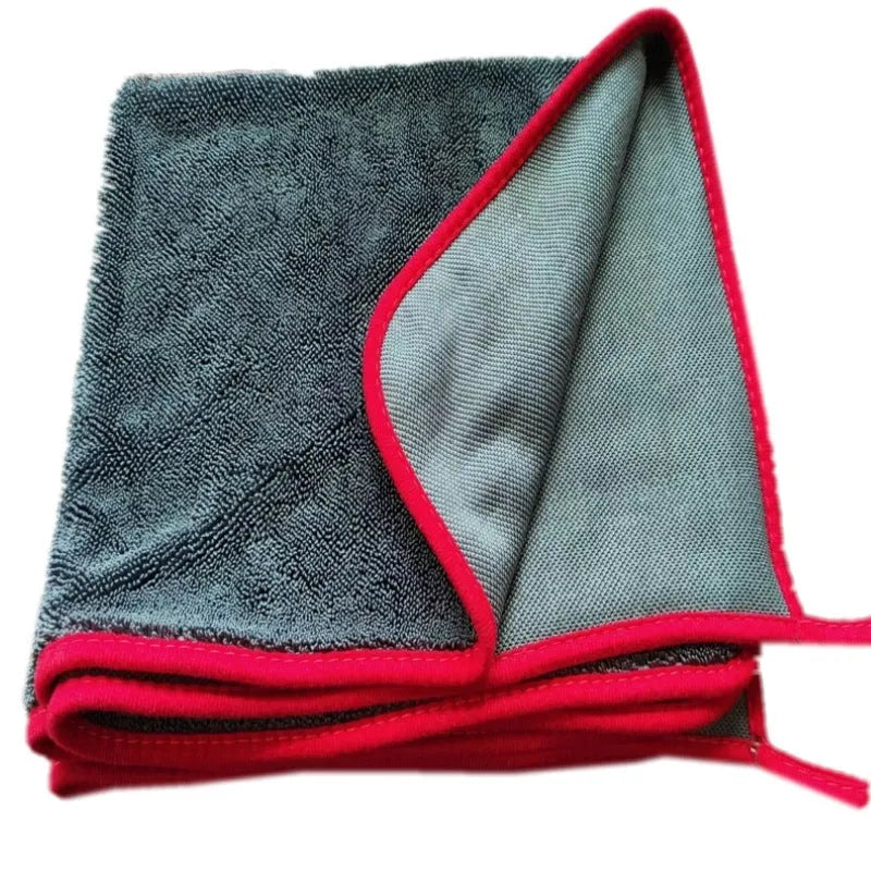 Grey car cleaning cloth with black hemmed edge shown in various sizes for vehicle and pet care.
