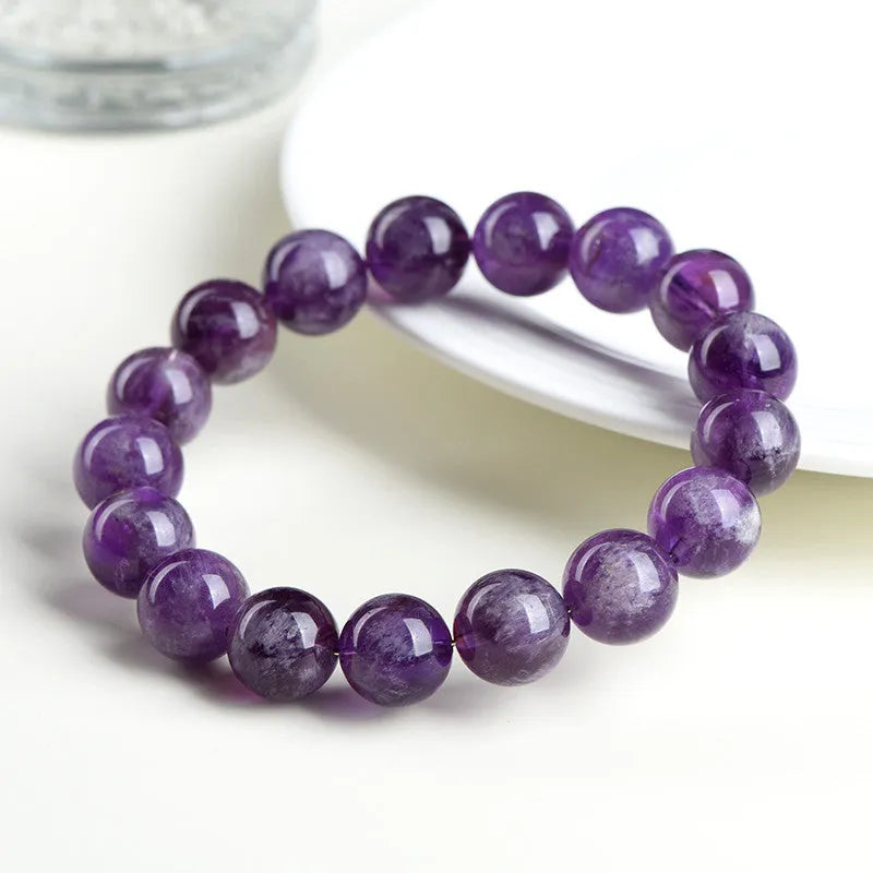 Natural feather amethyst Snow Mountain purple crystal bracelet with geometric beads and Ruyi symbol.