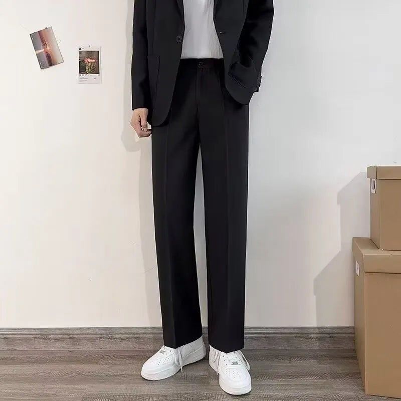 Men's plus size college style suit set in grey, featuring a blazer, trousers, white shirt, and tie.