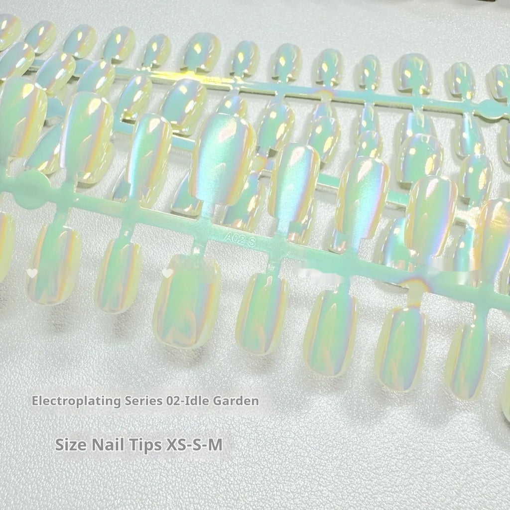 Set of electroplated Cat's Eye false nails showing Aurora armour style on short ladder sized nails.