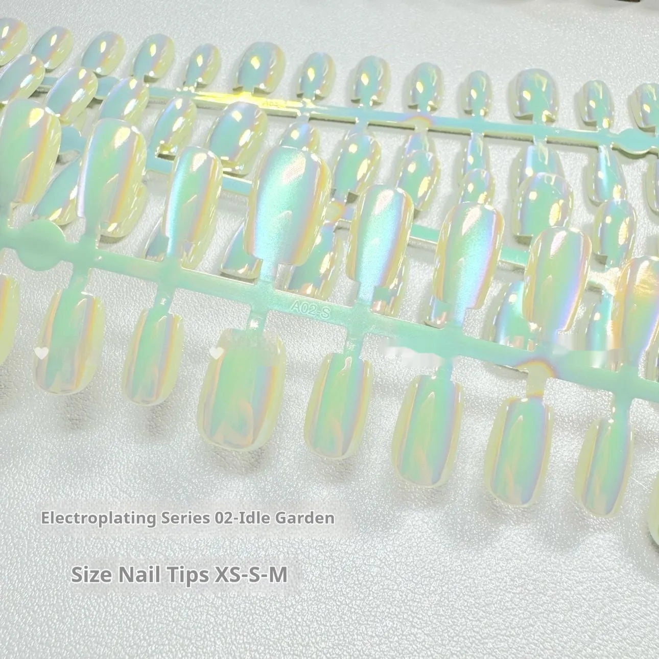 Set of electroplated Cat's Eye false nails showing Aurora armour style on short ladder sized nails.