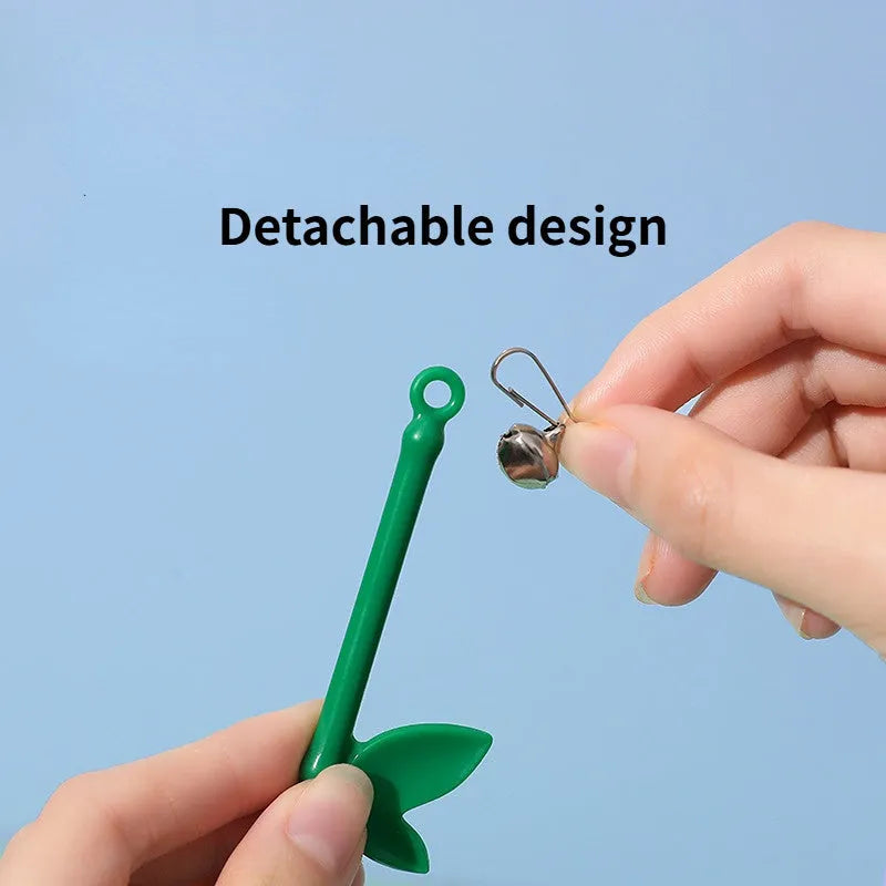 Green interactive cat feather wand toy with bells and feathers on a durable string