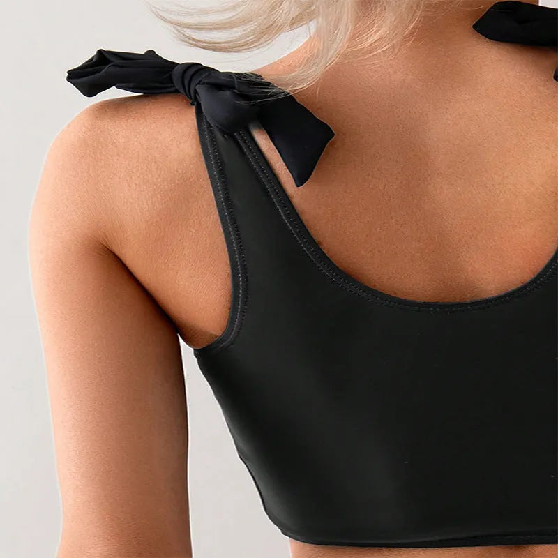 Women's coconut print bikini swimsuit with lace-up front and separate pants.