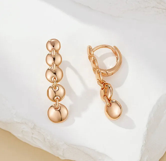 Retro long copper circle earrings with woven wirework and gold-coloured finish