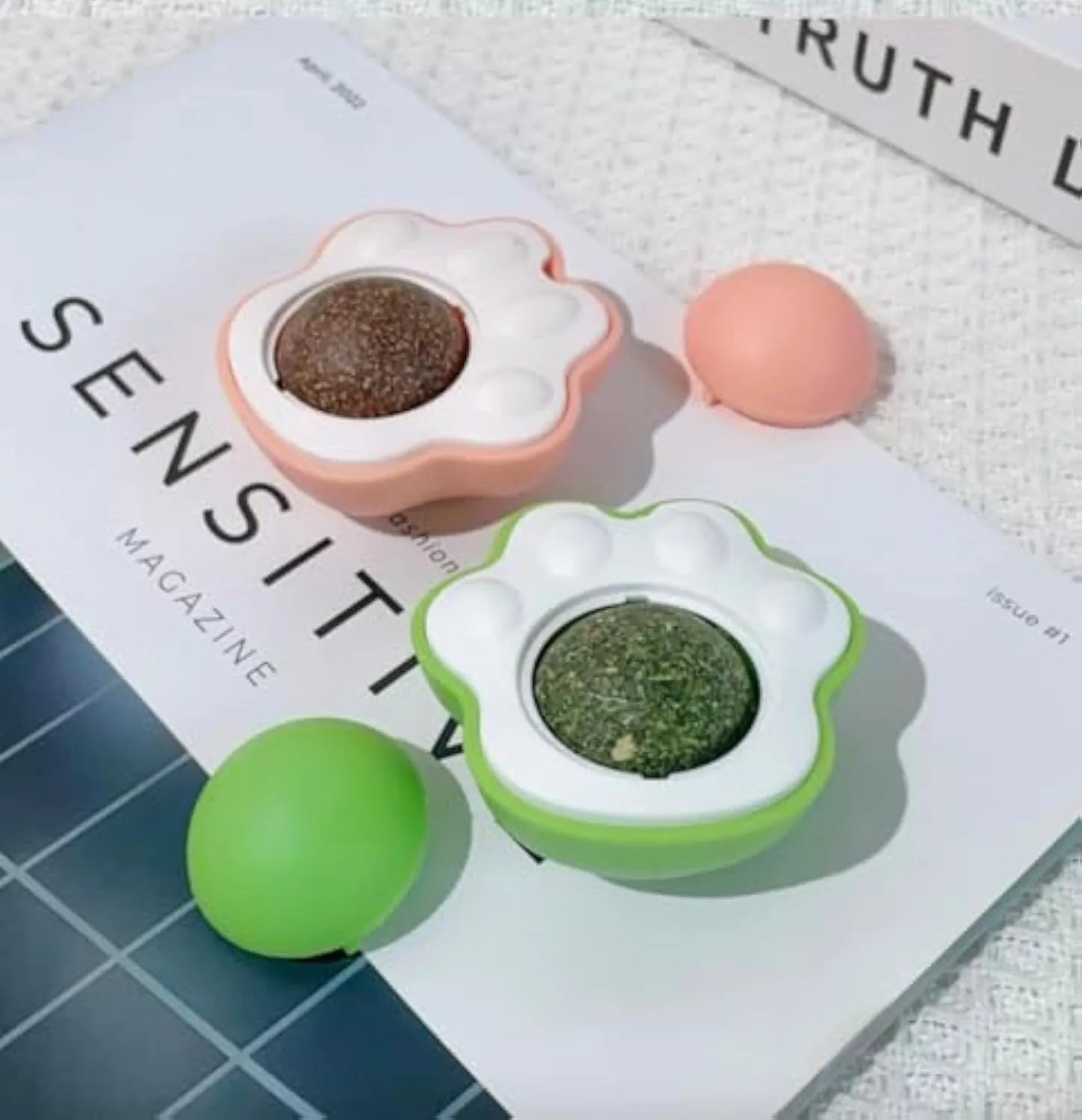 Four colourful catnip balls with textured surfaces for dental cleaning and feline play