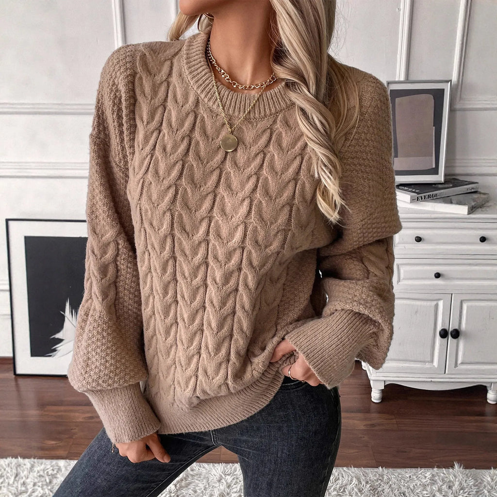 Women's beige loose sweater with round neck and twisted yarn detail on solid polyester fabric