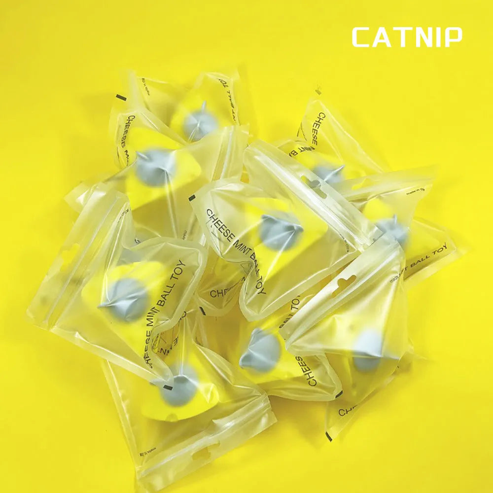 Yellow cheese-shaped cat toy ball with textured surface for teeth cleaning, filled with catnip and silvervine.