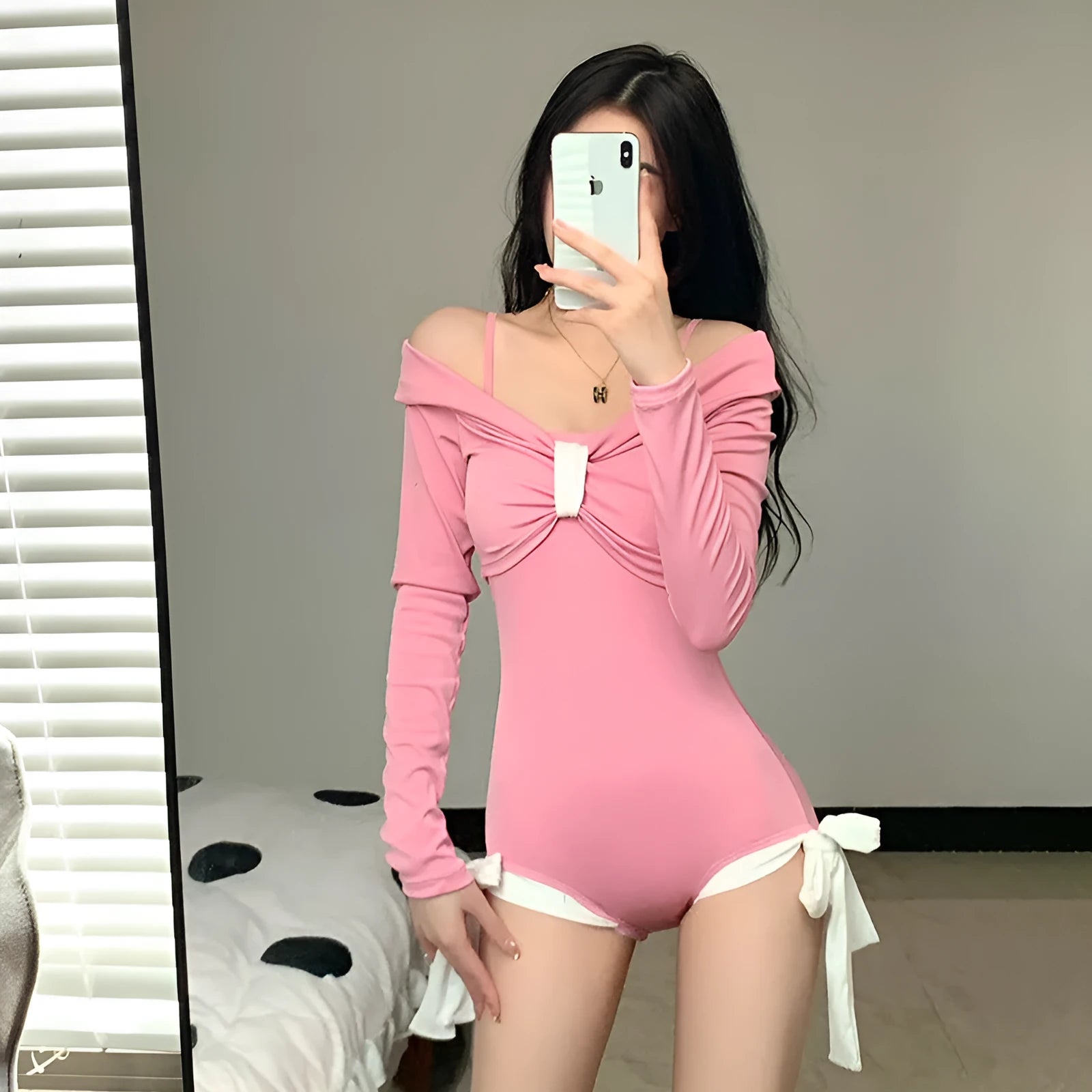 Women's long sleeve one-piece swimsuit in pink or black colours