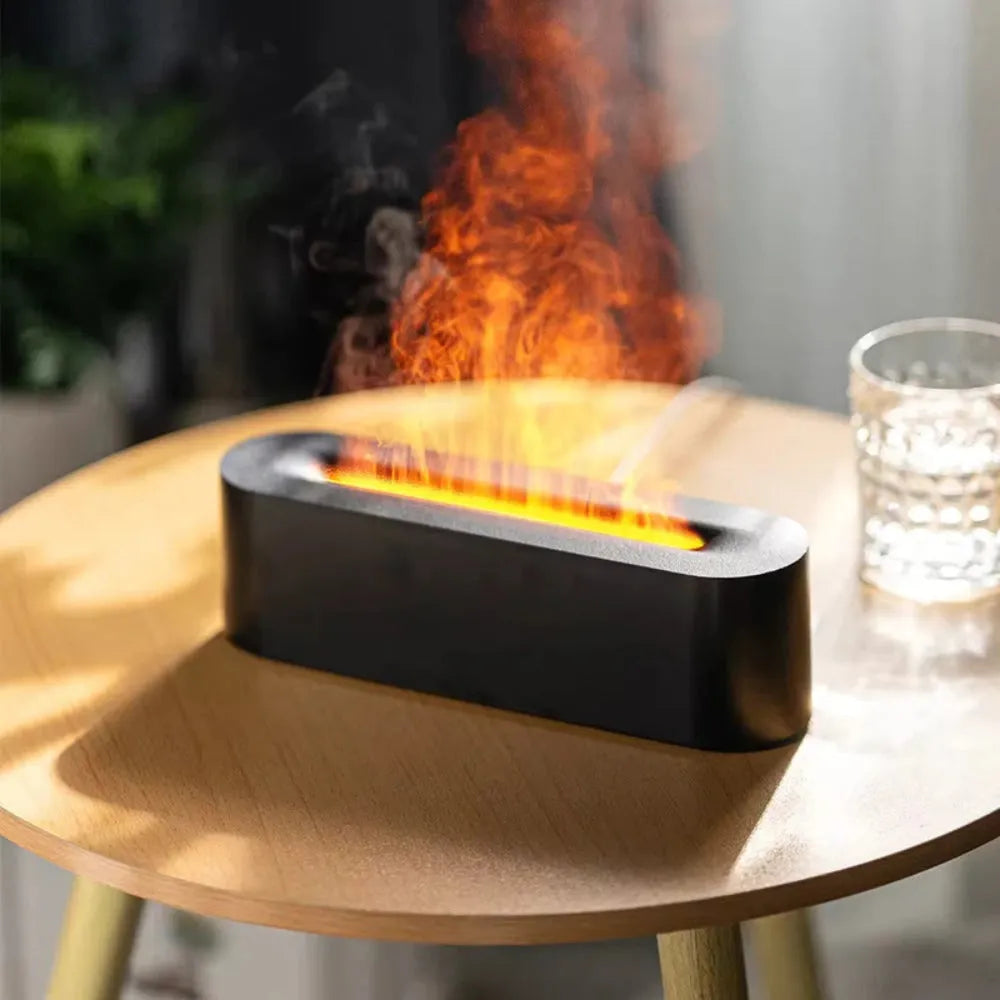 Square-shaped lava lamp-style USB aroma diffuser humidifier with colourful flame light effect on a desk.