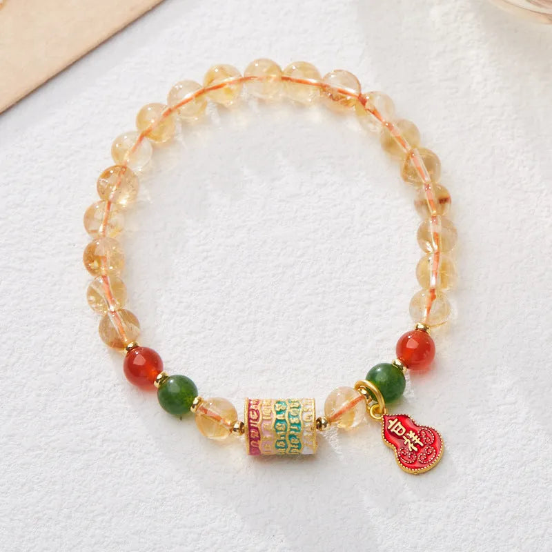 Hand-woven citrine five sutra bracelet with 6mm crystal beads showing geometric patterns