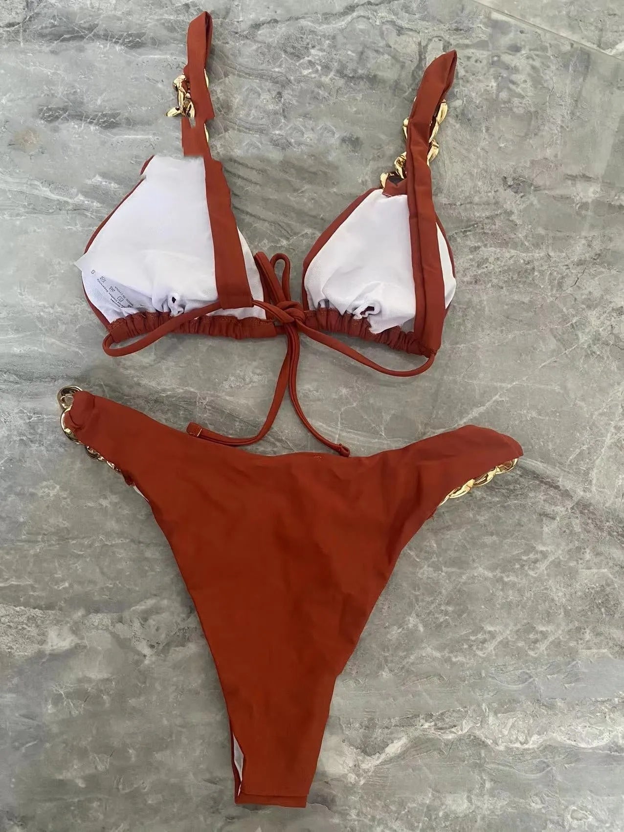 Brown women's tube-top push-up bikini swimsuit with ring tether and split bottom.