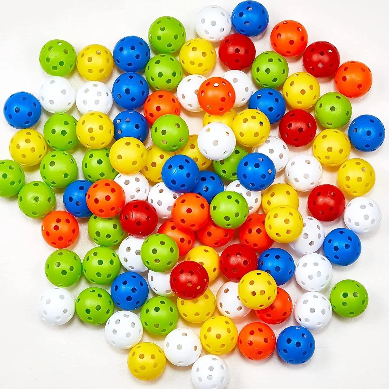 Multi-colour golf practice balls in net bag with 26-hole putting layout for skill development