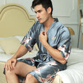 Mid-length printed artificial silk men's nightgown in cardigan style, black colour, on a hanger