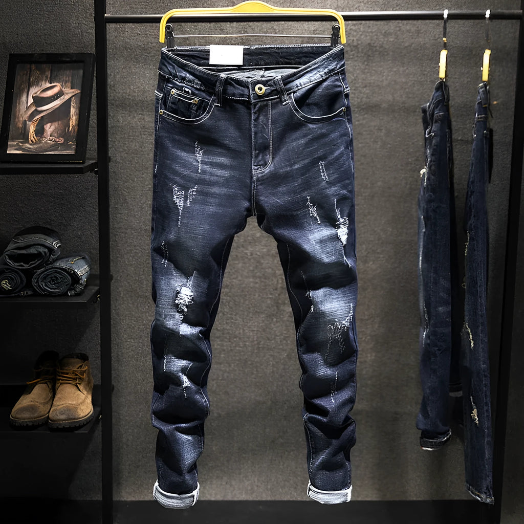 Men's slim-fit skinny jeans in dark blue cotton denim on a hanger.