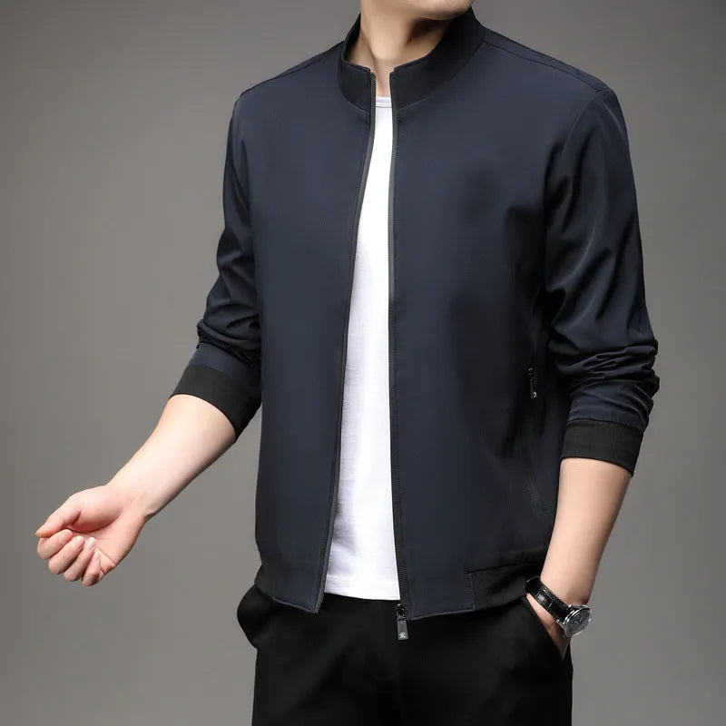 Man wearing a loose-fit black lapel jacket, Korean-style casual autumn coat with zipper pockets.