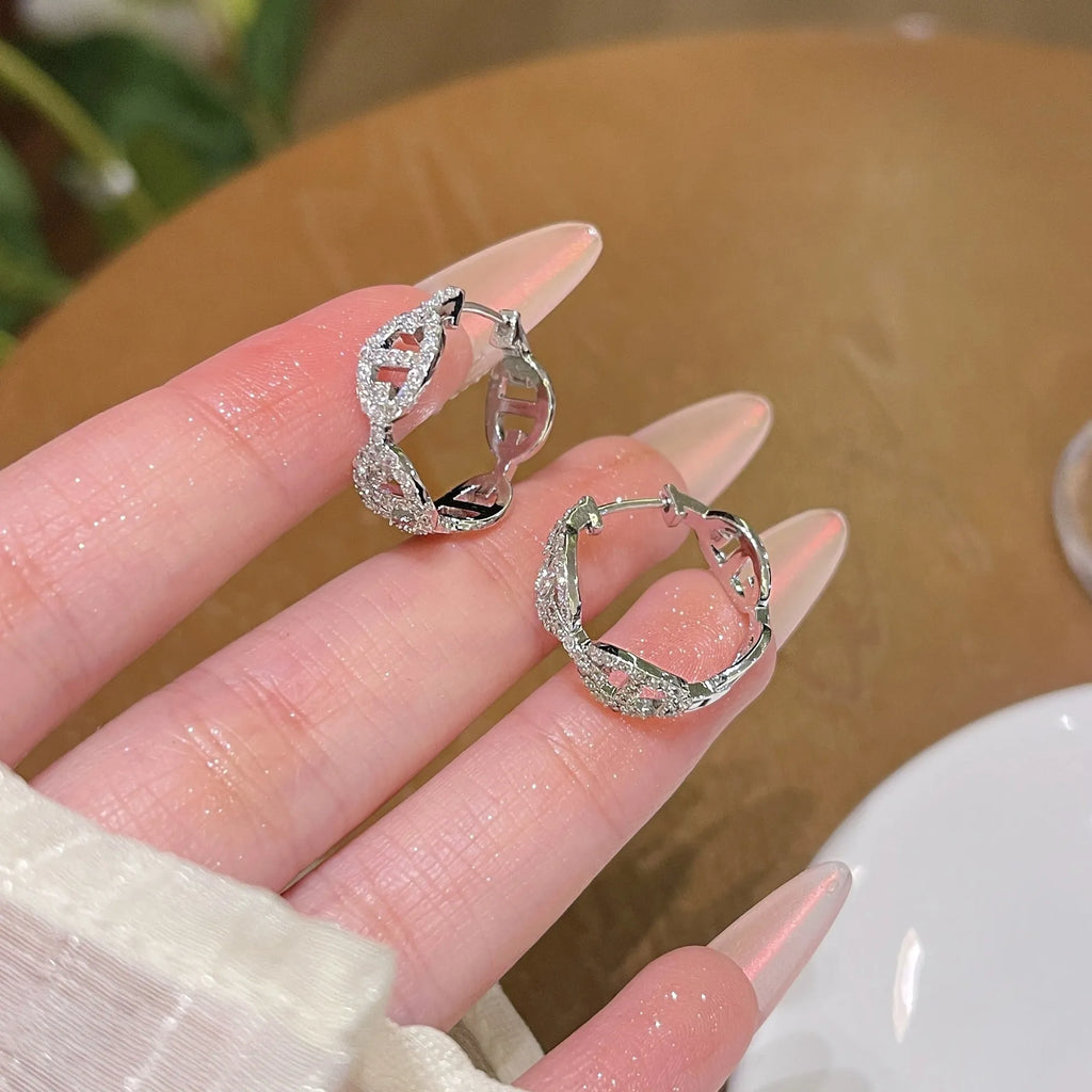 Ladies diamond detail earrings in silver, gold, and rose gold electroplated finishes