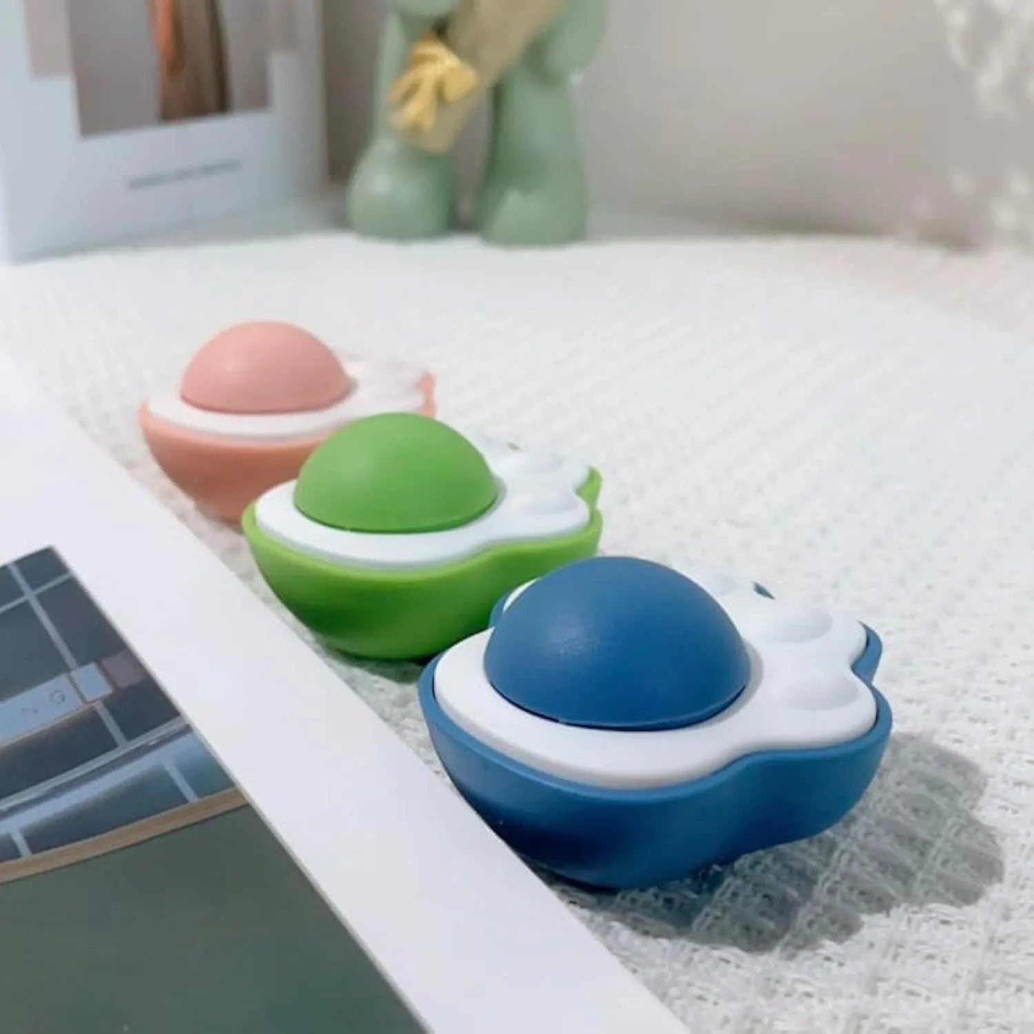 Four colourful catnip balls with textured surfaces for dental cleaning and feline play