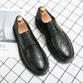 Men's black brogue leather shoes with round toe and traditional brogue detailing