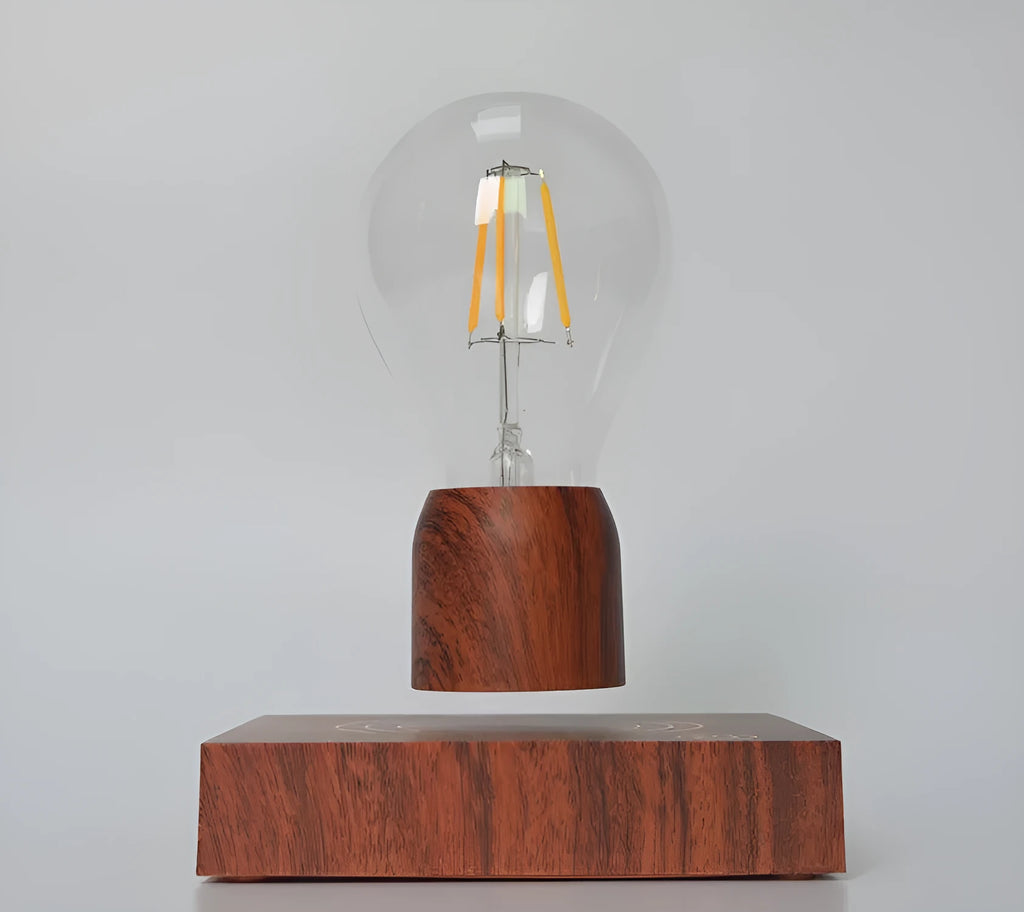 Magnetic levitation light bulb with imitation wood base on table.
