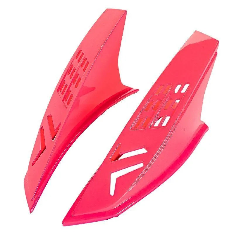 A pair of coloured helmet horns for child's motorcycle or ski helmet modification.