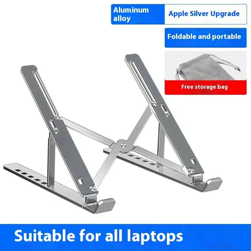Silver aluminium alloy folding laptop stand with black silicone pads on a wooden desk.