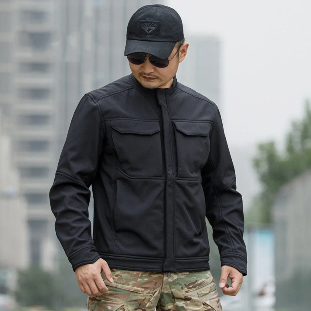 Bone Frog Peak Breaker soft shell tactical jacket in black, shown in outdoor setting.