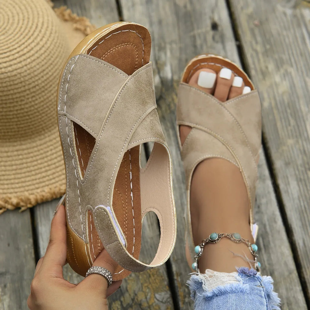 Roman platform sandals with a skirt detail and open toe design on a rubber sole