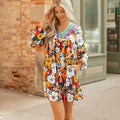Orange floral print women's mini dress with striped lace detailing, v-neck, and long sleeves