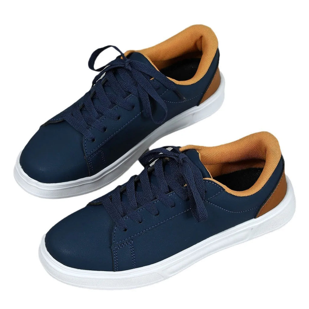 Women's beige brown platform skateboard sneakers with a cross strap and flat rubber sole.