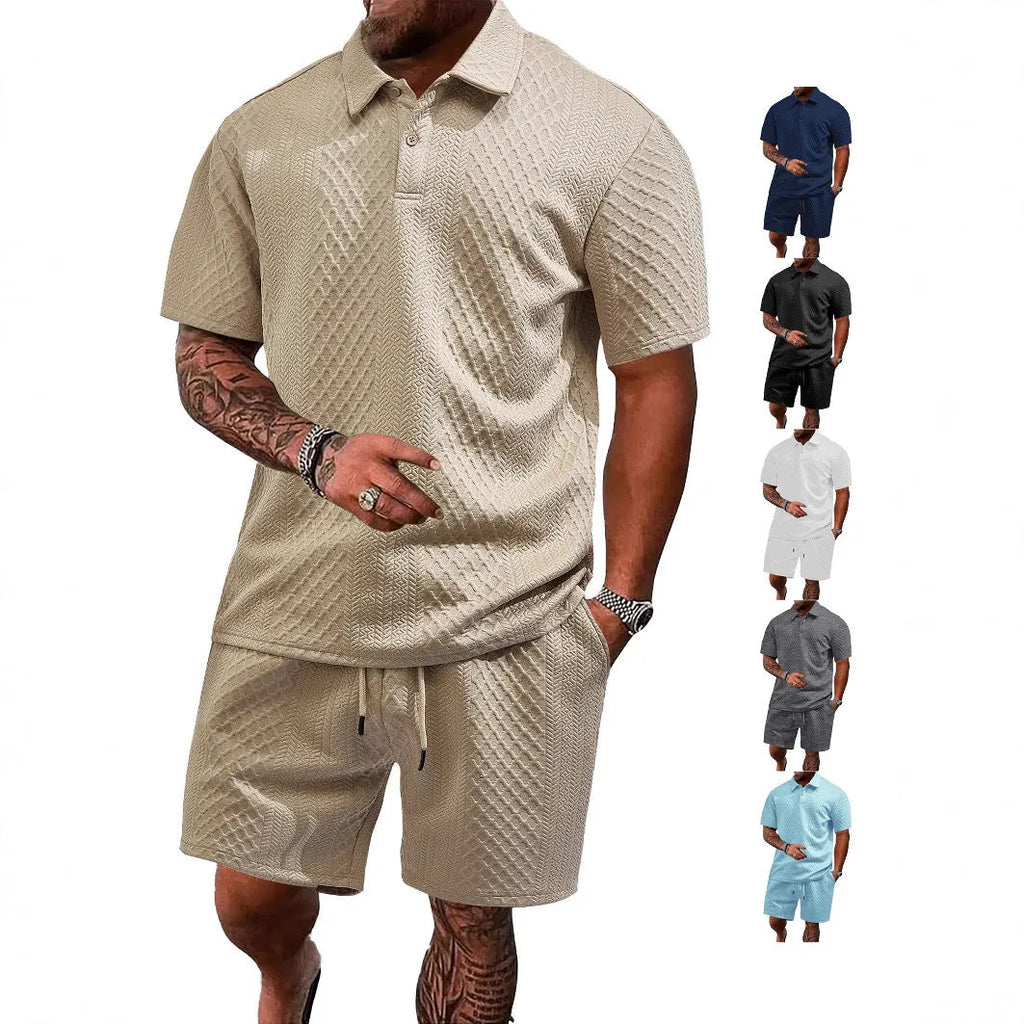 Man wearing a light grey thin figured cloth short-sleeve polo suit with matching trousers.