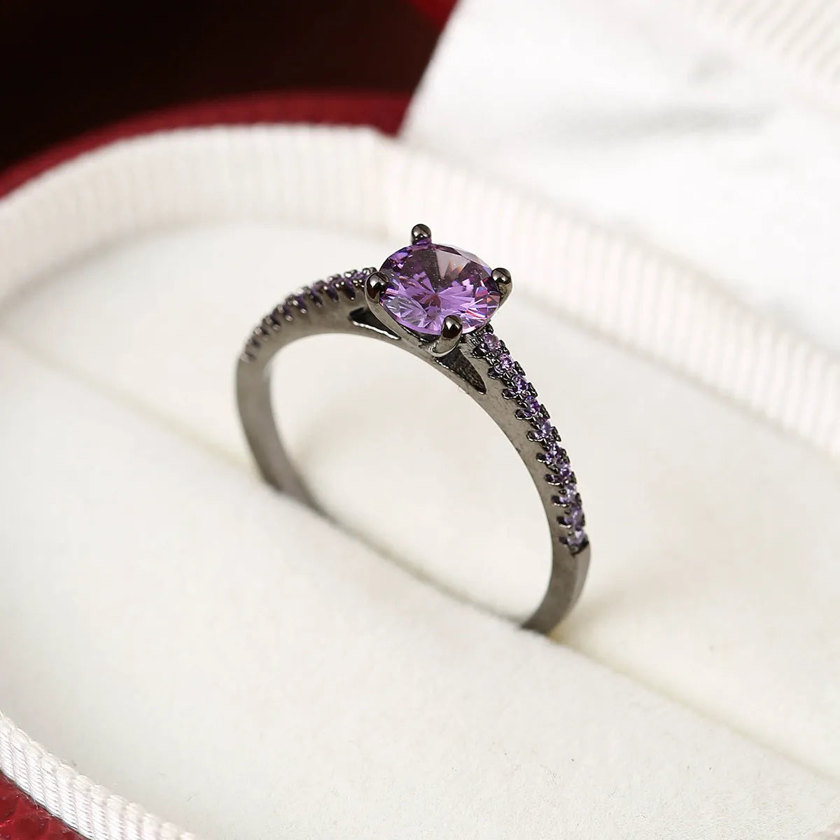 Hexagonal geometric zircon ring in copper with electroplated finish showing angular design and zircon stone
