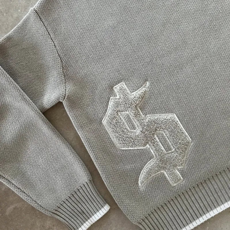 Grey jacquard knitwear coat with loose fitting design and long sleeves