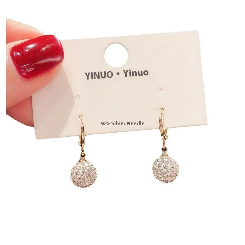 Women's copper geometric drop earrings with rose design and zircon accents in electroplated finish