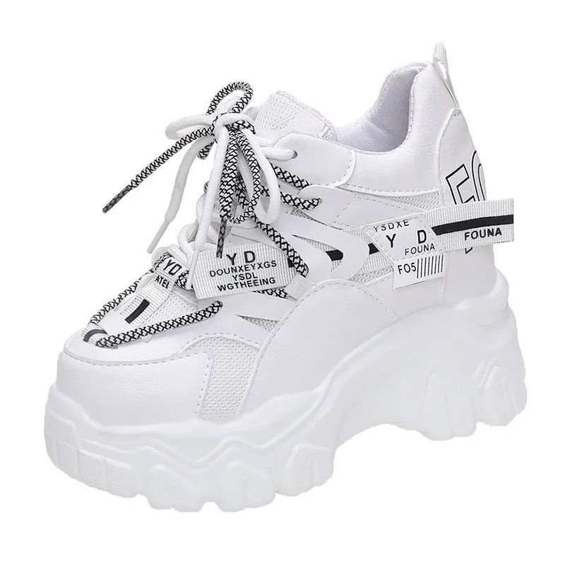 Women's white and black mesh platform sports shoes with cross-strap design and rubber sole
