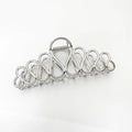 Gold and silver alloy hair clip with tassel detail for updo hairstyles