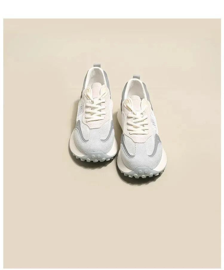 Women's gray and pink retro sneakers with mesh lining, rubber sole, and low-top design