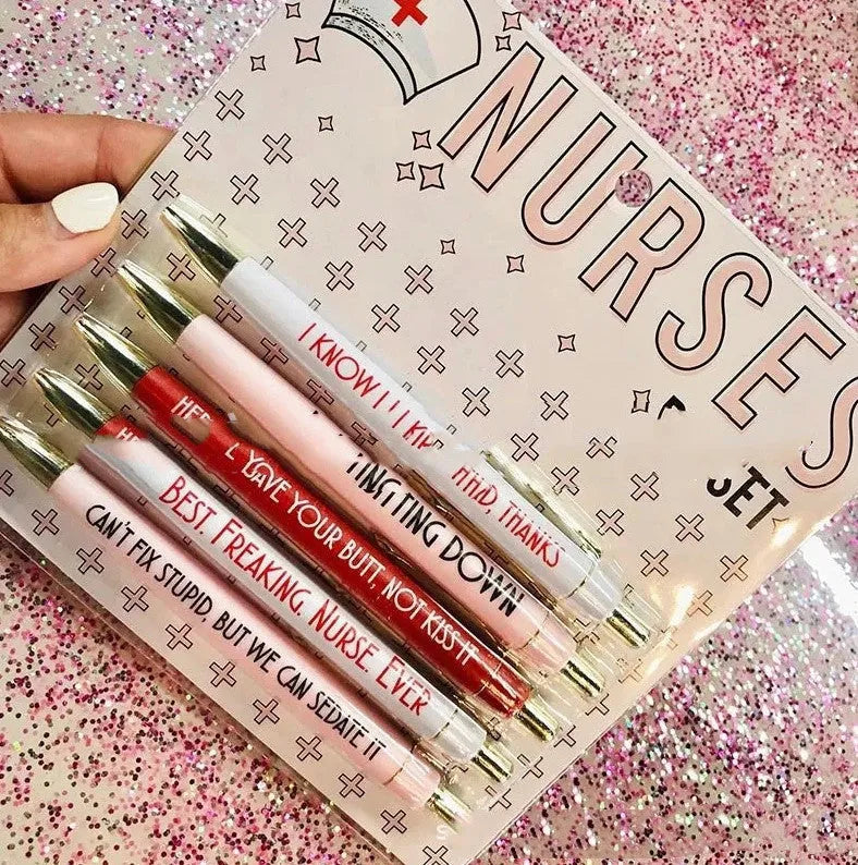 Set of five plastic retractable ballpoint pens with nurse-themed text and slogans.