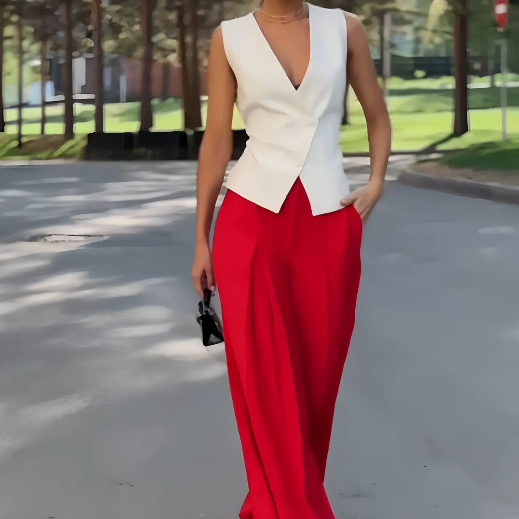 Women's beige two-piece set featuring a sleeveless deep V-neck top and high-waist wide-leg trousers.
