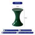 Hourglass-shaped plastic stool in green for changing shoes, used by an adult and child.