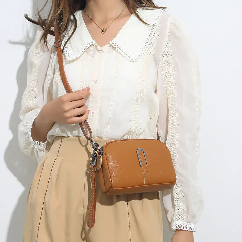 Genuine leather women's shoulder bag in horizontal square shape, shown in one of five colour options.