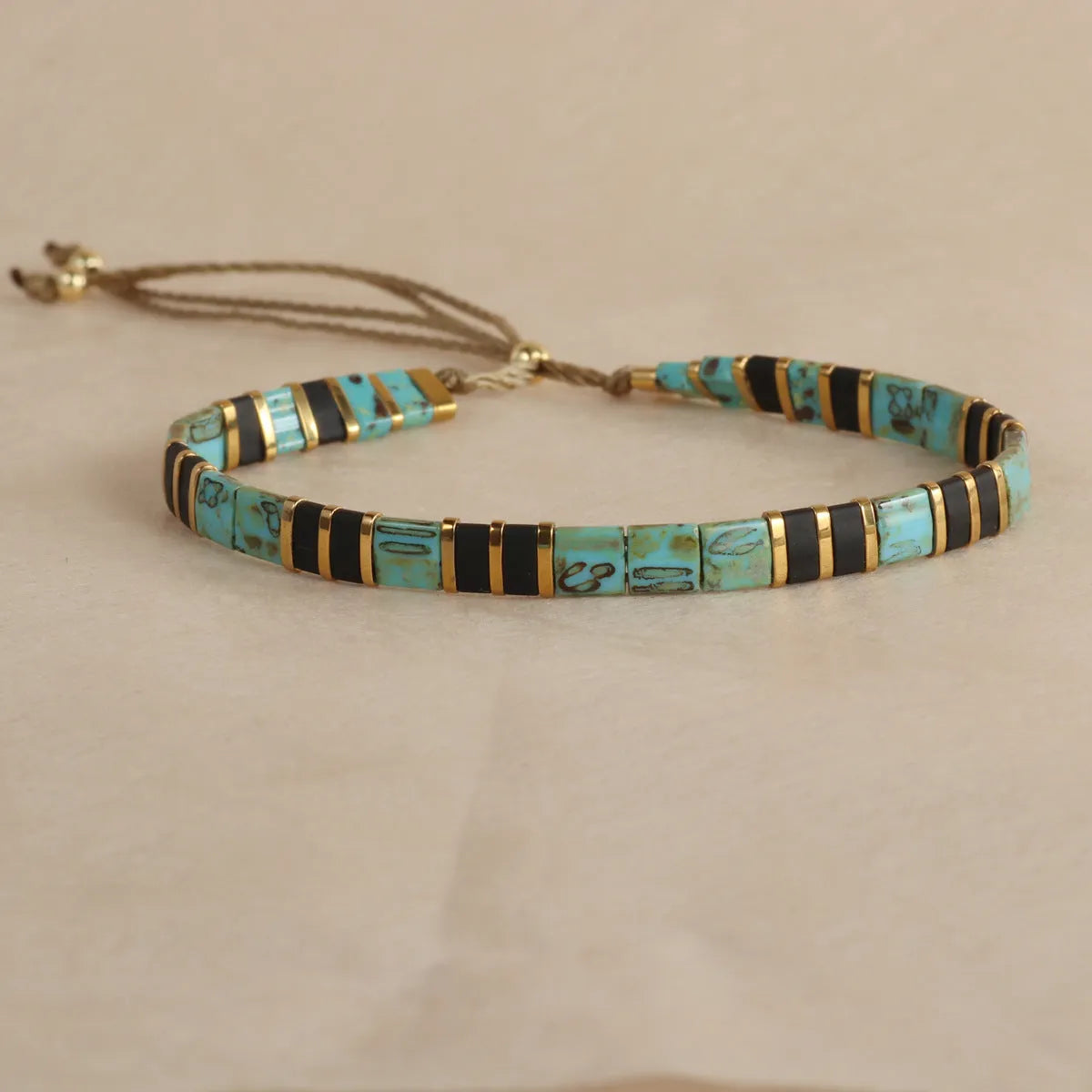 Geometric glass and coloured glaze beaded bracelet with round elements in five colour options
